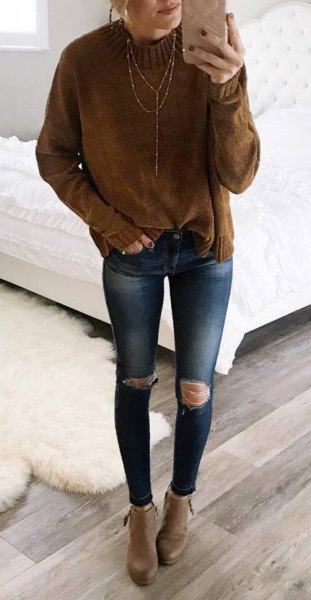 Chunky knit sweater with brown mock neck and blue skinny jeans