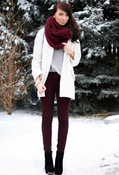 brown scarf white wool coat black cord pants