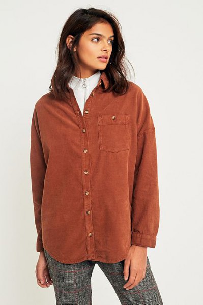 brown shirt over white mock neck sweater