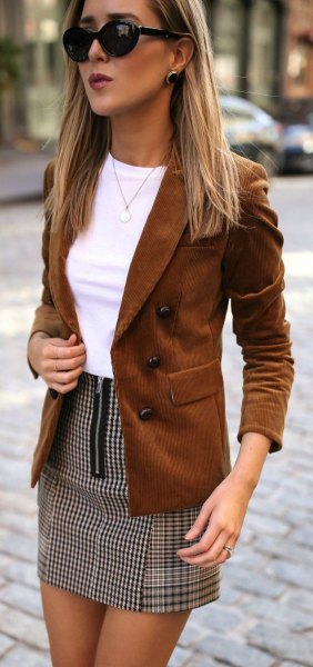 brown suede blazer with white top and checked mini skirt
