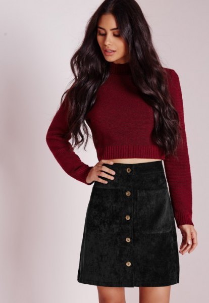 Burgundy red knitted sweater with black corduroy mini skirt