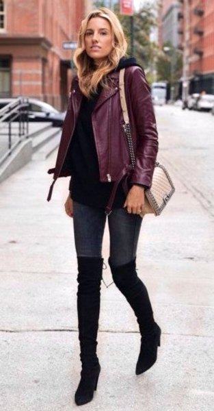 Burgundy jacket with black sweater and overknee boots