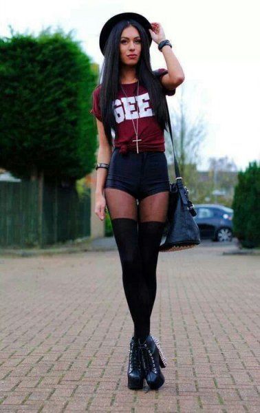Burgundy knotted t-shirt with black mini shorts and tights