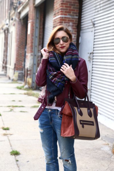 Burgundy leather jacket with black and blue checked scarf
