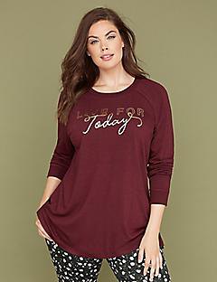 burgundy long sleeved graphic t-shirt with black and white polka dot trousers