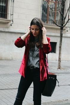 Burgundy velvet jacket with gray graphic t-shirt and black jeans
