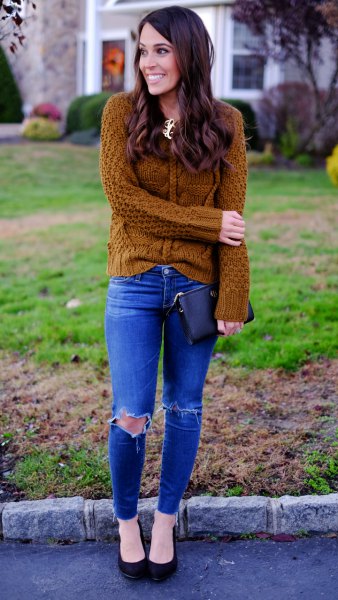 Cable knit sweater with royal blue skinny jeans