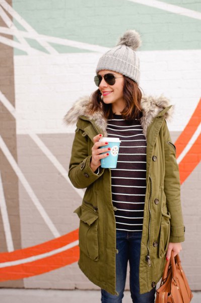 Camel-lined parka coat with a black and white striped T-shirt
