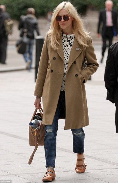 Camel long wool coat with torn boyfriend jeans and light brown evening shoes with rounded toes