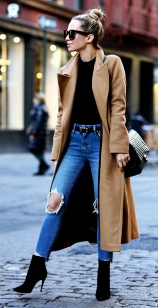 Camel taxi wool coat with black top and ripped blue jeans