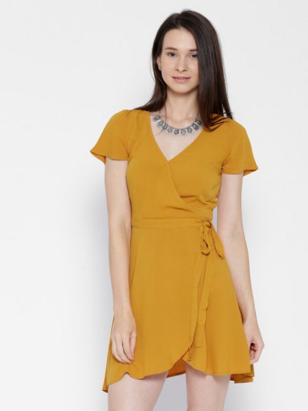 Mini chiffon wrap dress with cap sleeves and a statement chain