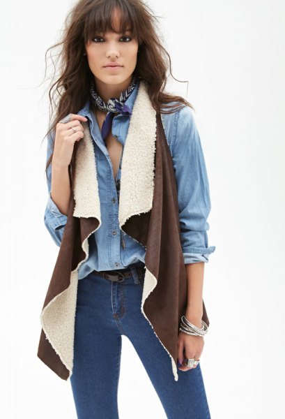 Chambray shirt with skinny jeans made from brown lambskin vest