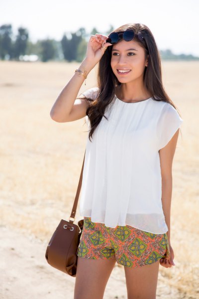 short white top made of chiffon orange with a floral pattern