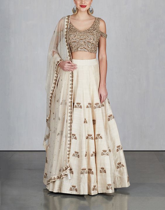 Off White Ginkgo Lehenga with Cold Shoulder blouse and dupatta .
