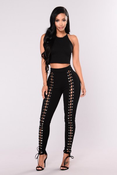 Crop top with black, narrow lace-up pants and open toe heels