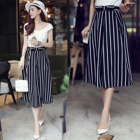 short-cut black and white striped trousers with wide legs and a white felt hat