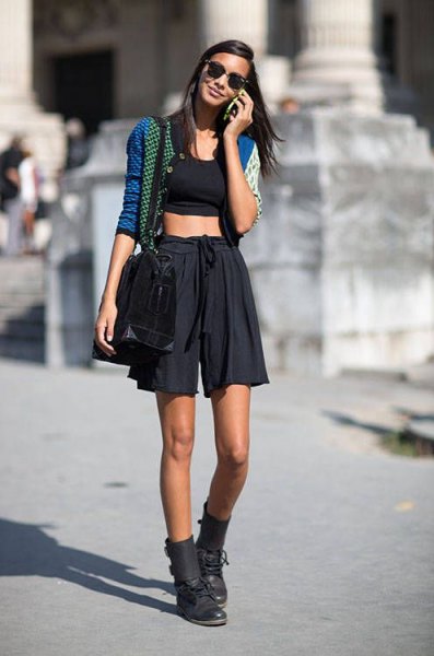 short blue cardigan with black crop top and minirater skirt