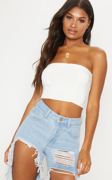 short tube top with badly torn boyfriend jeans