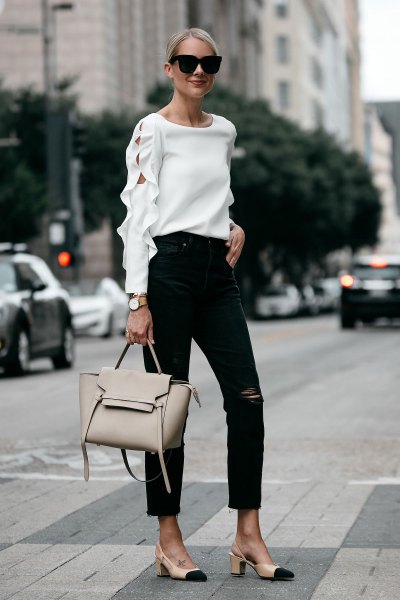 Neckline white sweater with ankle black jeans and pink heels