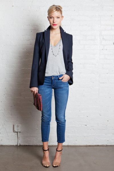 dark blazer with gray t-shirt with deep scoop neck and short jeans