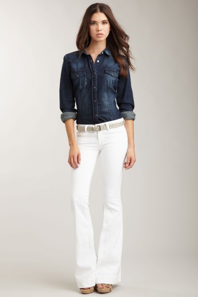 Dark blue denim shirt with button closure and white jeans with belt