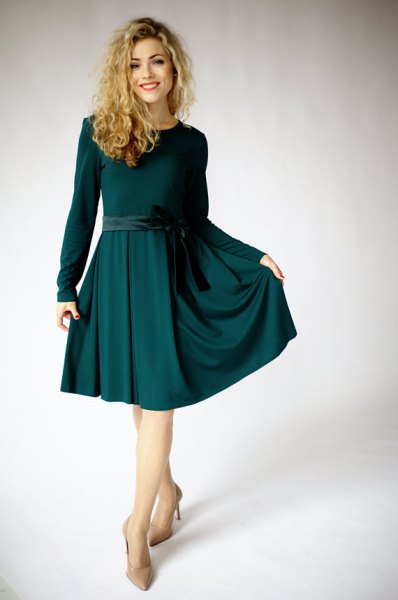 knee-length, flared dress with a dark green belt and long sleeves