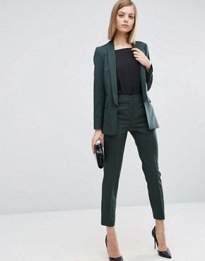 dark green suit with black t-shirt and pointed toe heels