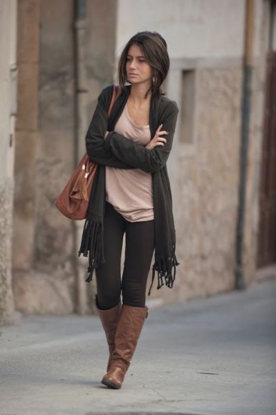 dark gray cardigan with fringes, light pink top with scoop neckline and brown leather boots
