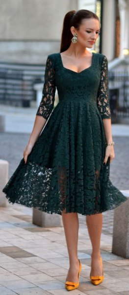 dark gray three-quarter-sleeved lace dress and flared midi dress with yellow heels
