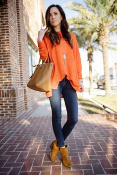 dark orange leather ankle boots with chiffon blouse and jeans