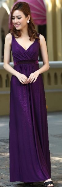 dark purple maxi dress with deep V-neckline and black, open toe heels