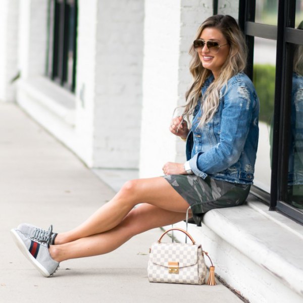 Denim jacket with camo mini shorts and light gray chambray sneakers