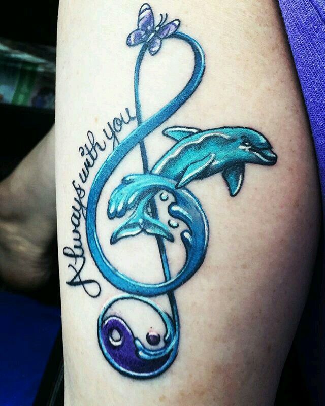 Dolphin musical note tattoo design