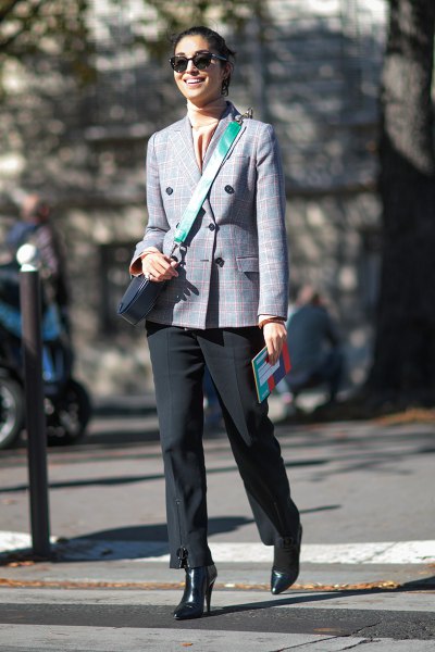 Double-breasted checked blazer with a light pink silk top and black trousers