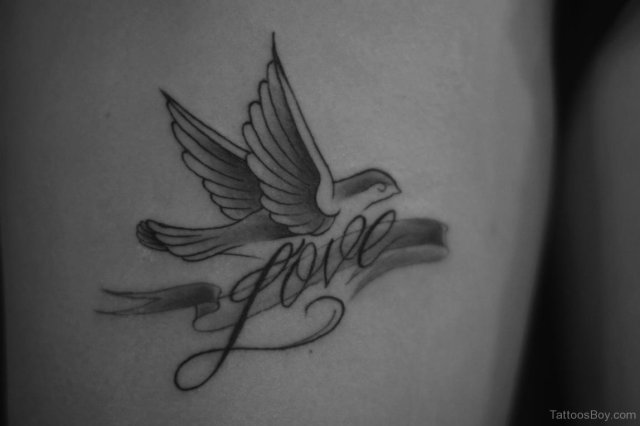 Dove with a word tattoo love