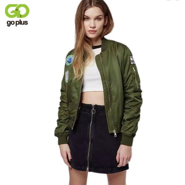 embroidered olive green bomber jacket with white crop top and black skyscraper