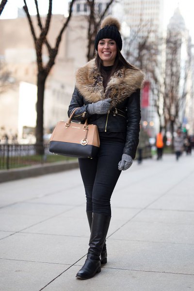 Leather jacket with a faux fur collar and knee-high boots