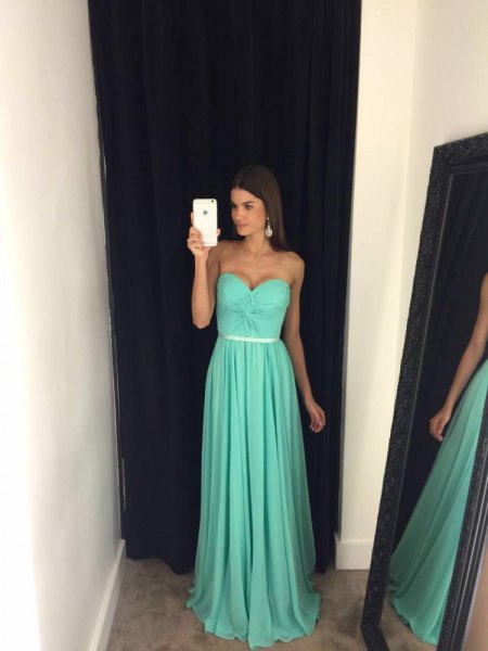 Fit and flare belt strapless floor length pleated ball gown