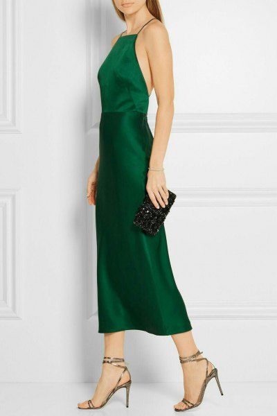 Fit and flare halter green silk dress with clutch purse