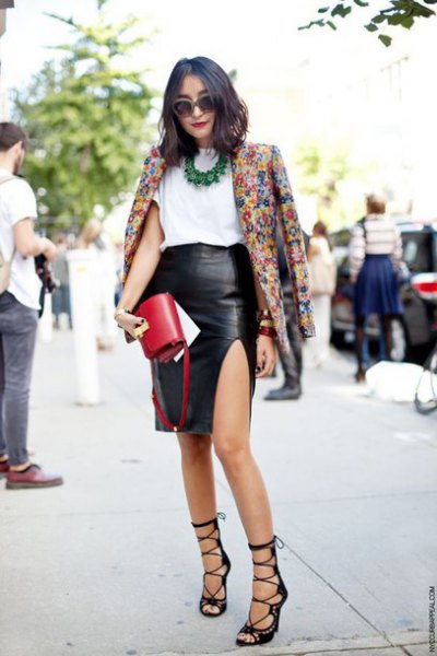 Blazer with floral print and black faux leather skirt with side slit