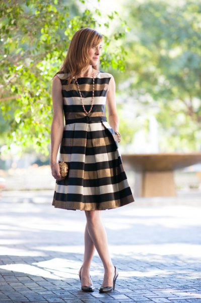 gold black white striped sleeveless flared dress