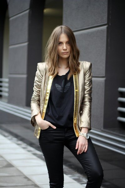 golden blazer with black t-shirt and leather gaiters