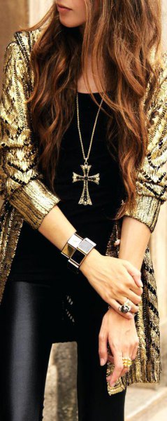 golden shiny long cardigan with sequins and black leather gaiters