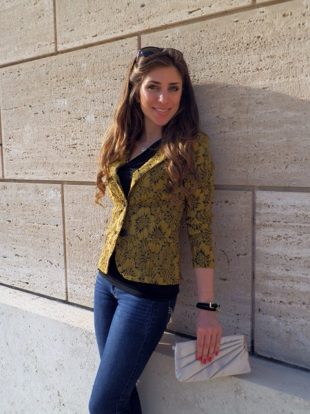 golden blazer with floral pattern and blue jeans