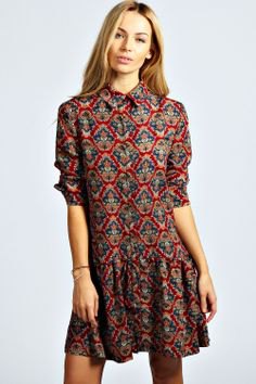 Dress with a green and navy blue tribal collar and a falling waist