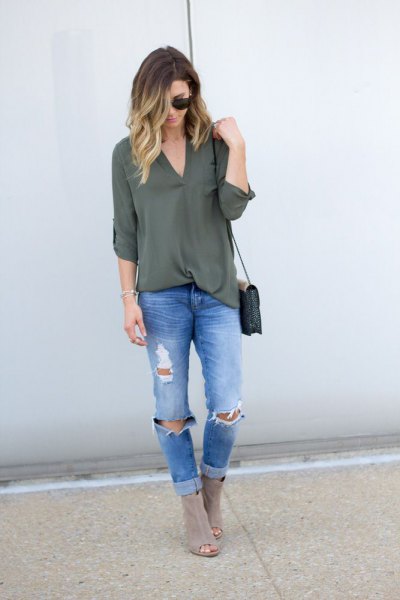 green chiffon layer with blue ribbed slim fit jeans and gray boots