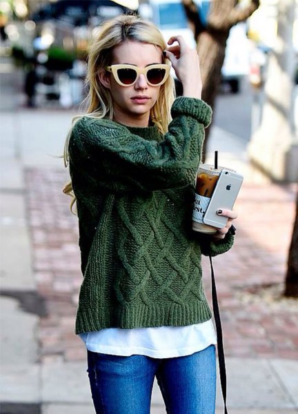 green skinny jeans with a coarse knitted sweater