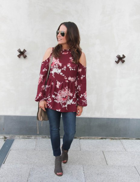 green blouse with floral print and cold shoulder and gray suede boots with open toe