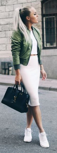 green, short cut bomber jacket with white, figure-hugging midi skirt