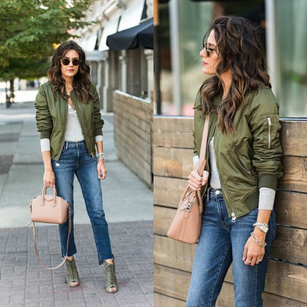 green aviator jacket with gray long-sleeved T-shirt and short jeans